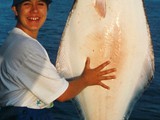 Happy Fisherwoman with Halibut